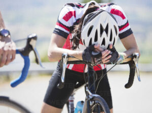 disappointed cyclist resting on handlebars CAIF04104