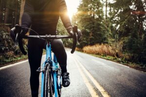 cyclist riding mountain road on racing bike royalty free image 1574115095